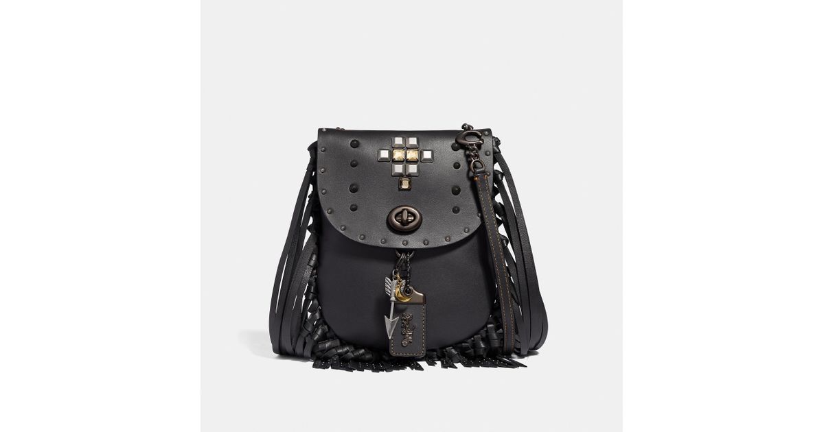 coach fringe saddle bag