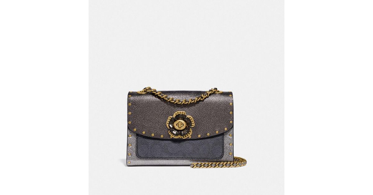 Coach parker with clearance rivets and snakeskin