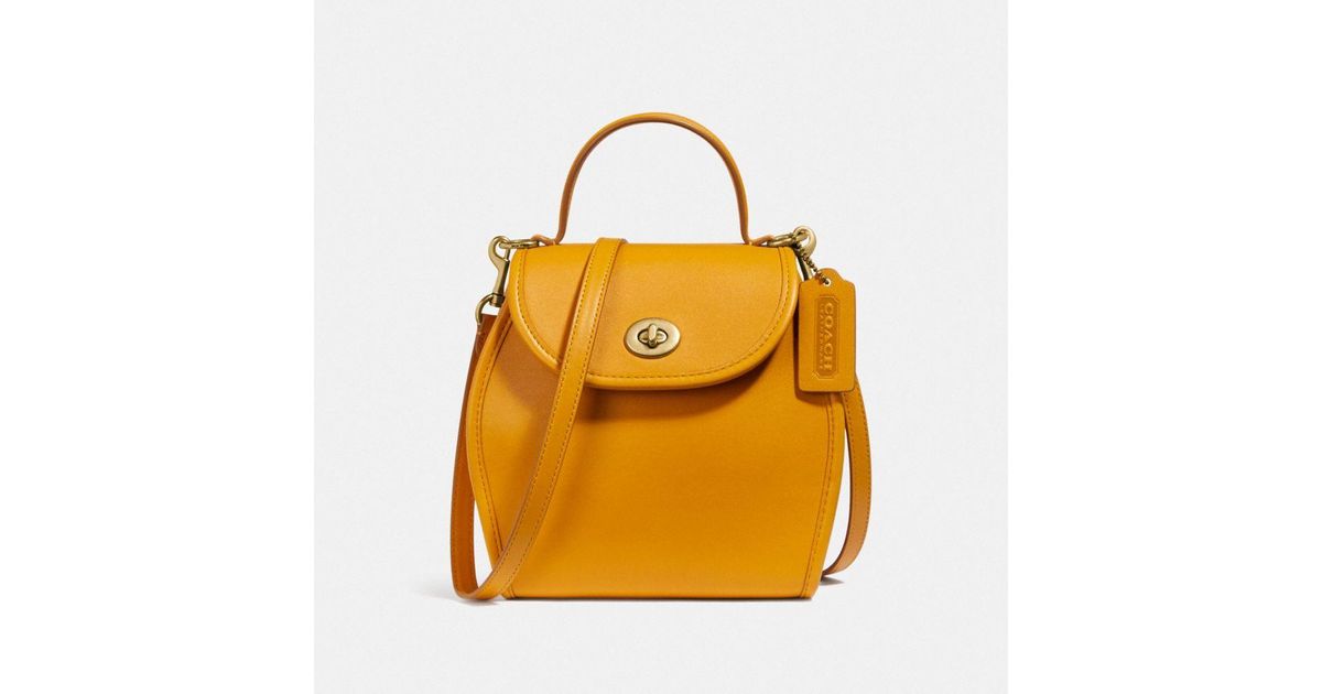 COACH Turnlock Curved Top Handle Crossbody in Yellow Lyst
