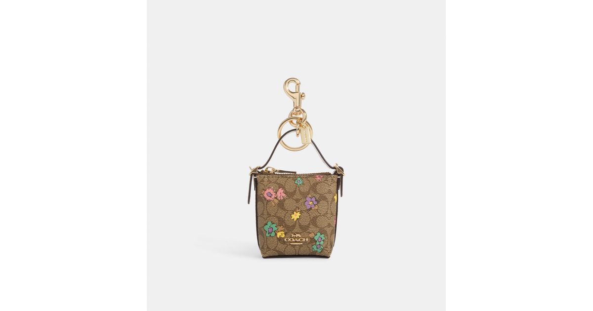 Coach Outlet Mini Val Duffle Bag Charm In Signature Canvas With Spaced Floral Print in Metallic