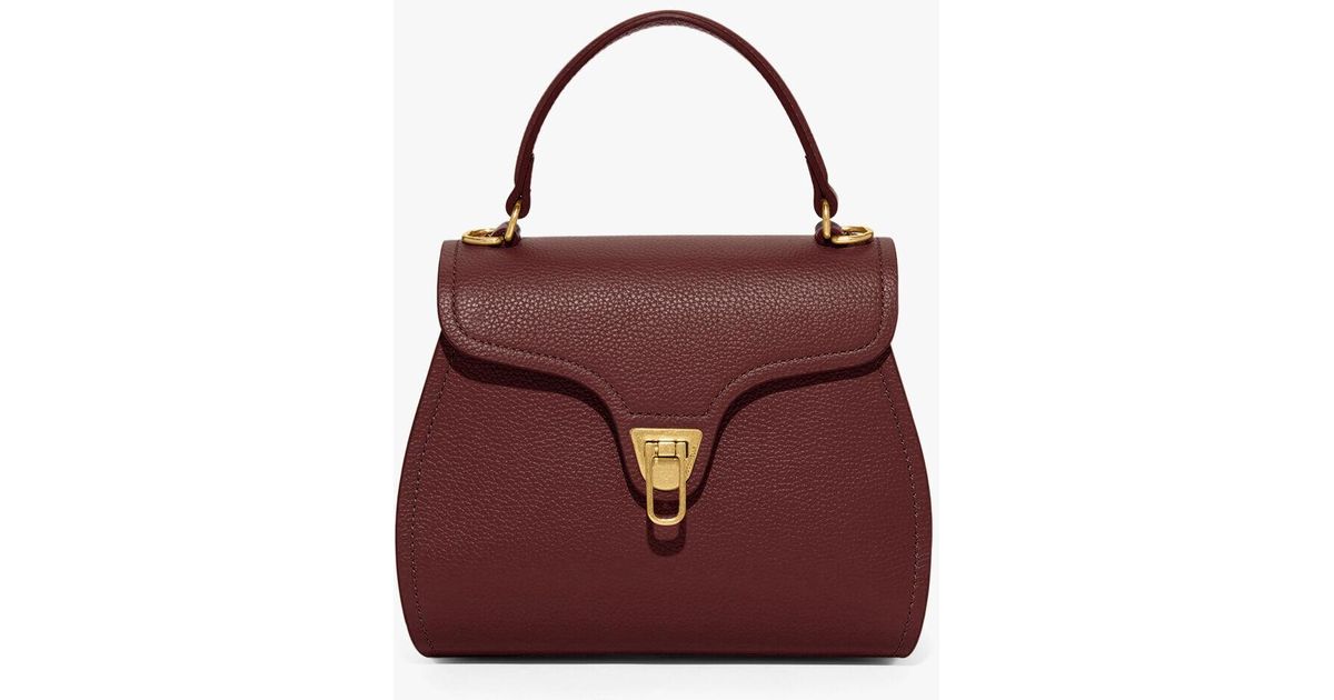 coccinelle marvin top handle bag