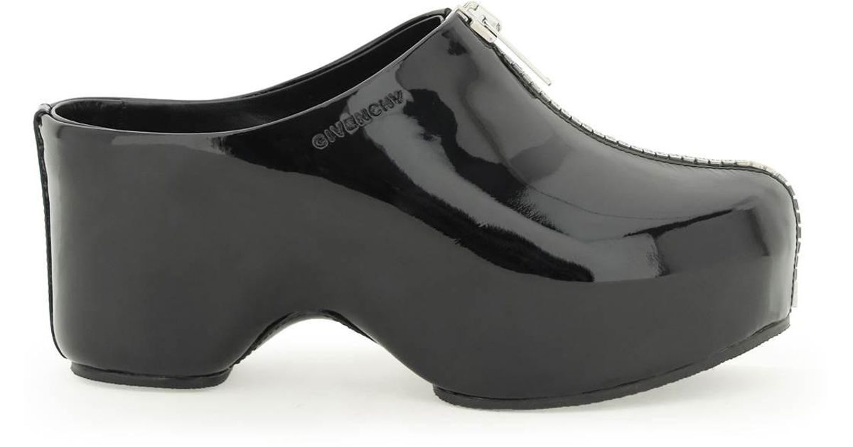 black patent leather clogs