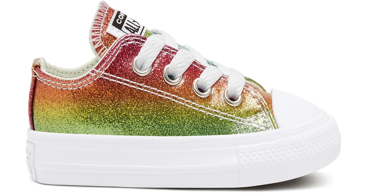 white converse with rainbow stitching