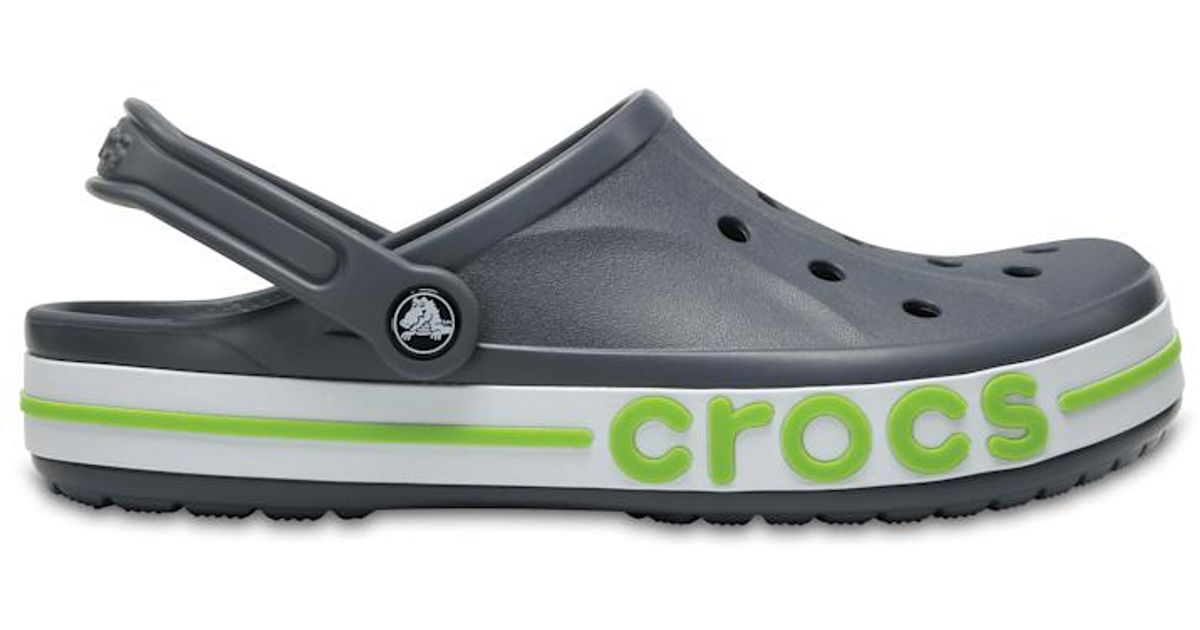 grey and green crocs