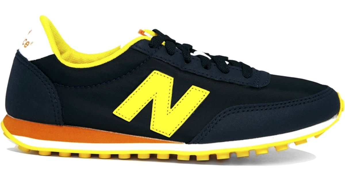 new balance blue yellow 410 trainers