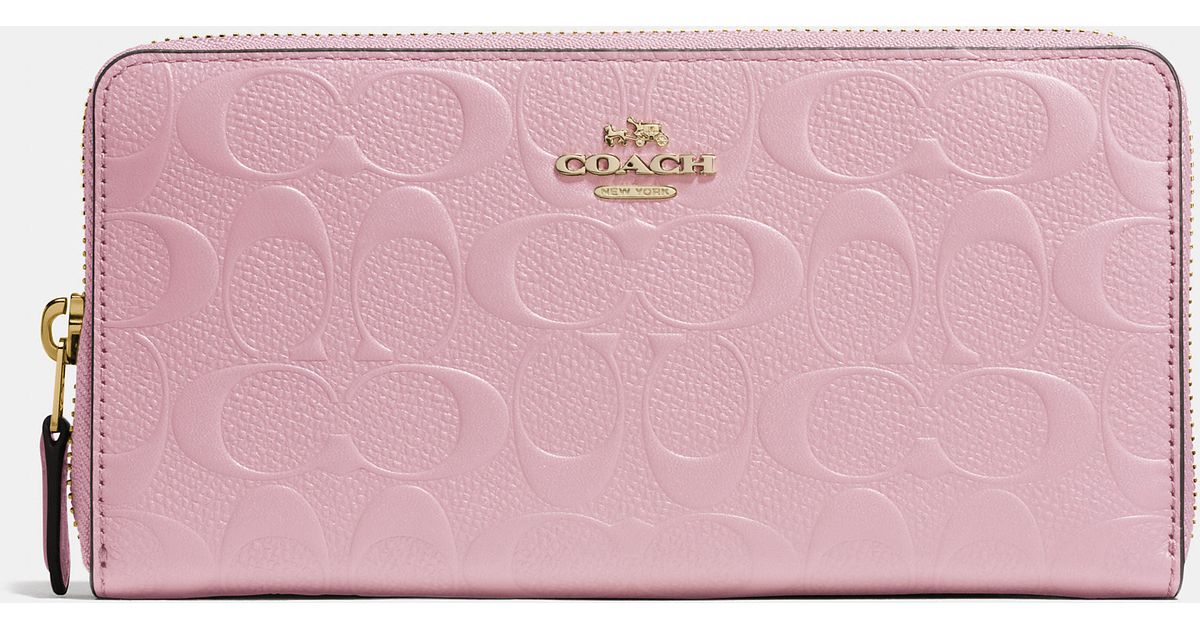 Buy the COACH Stripe Pink Signature Print Leather Passport Holder Wallet