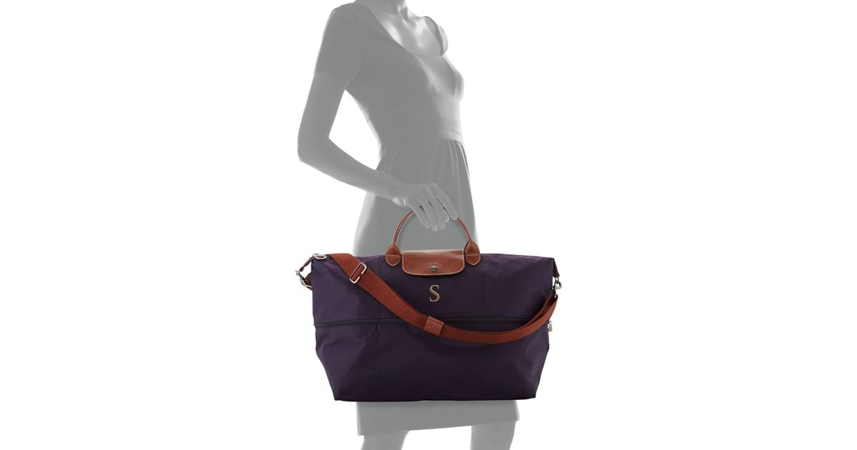 Lyst Longchamp Le Pliage Monogrammed Expandable Travel Bag In Blue