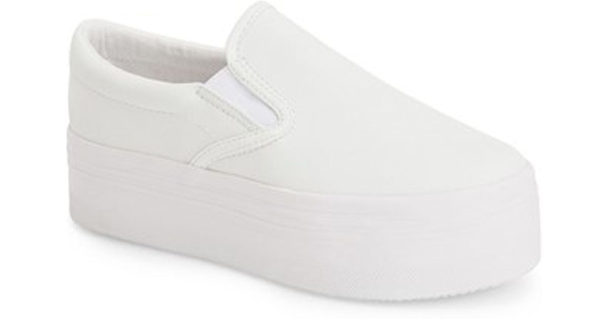 white slip on platform sneakers