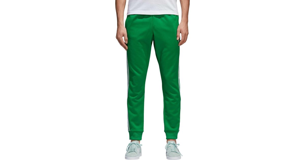 green adidas sst track pants