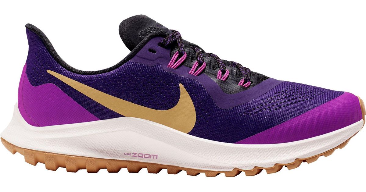 purple and gold running shoes