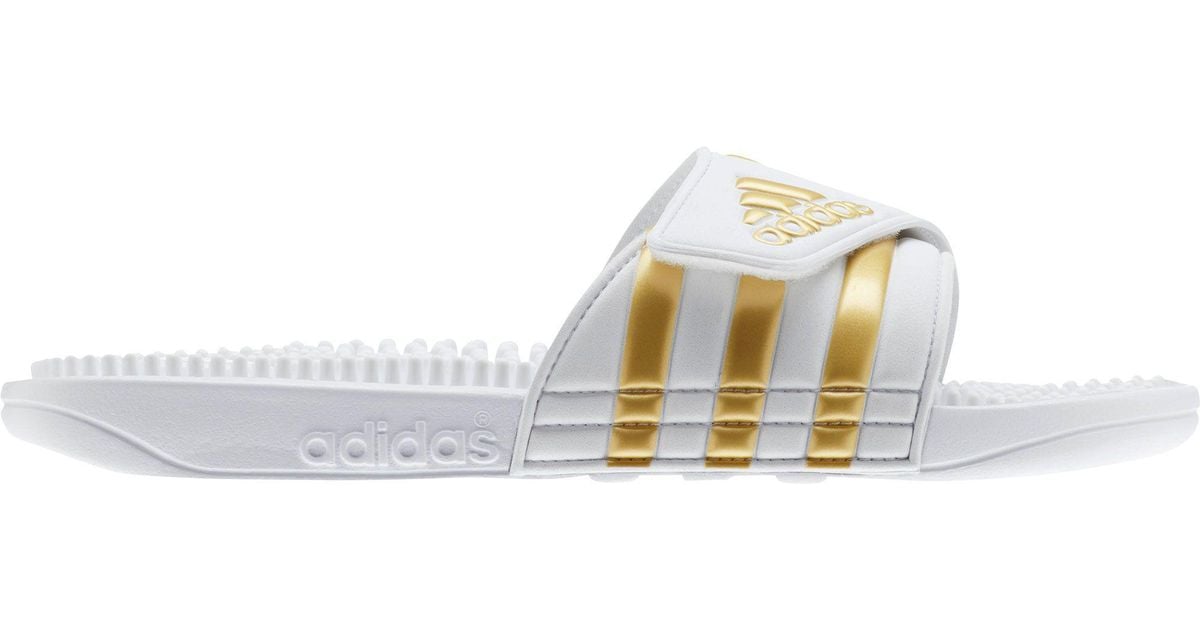 white and gold adidas slides