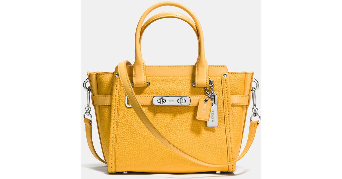 Lyst Coach Swagger 21 Carryall In Pebble Leather Yellow