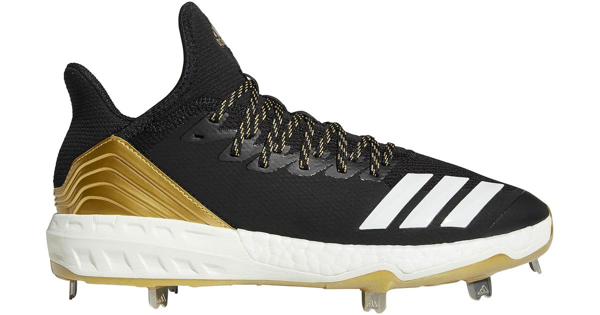 black and gold metal cleats