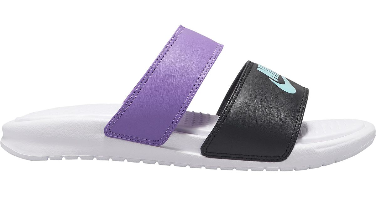 purple nike benassi slides