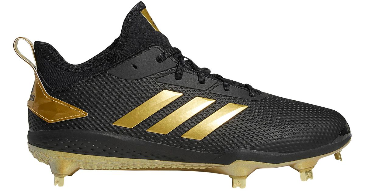 black and gold metal cleats