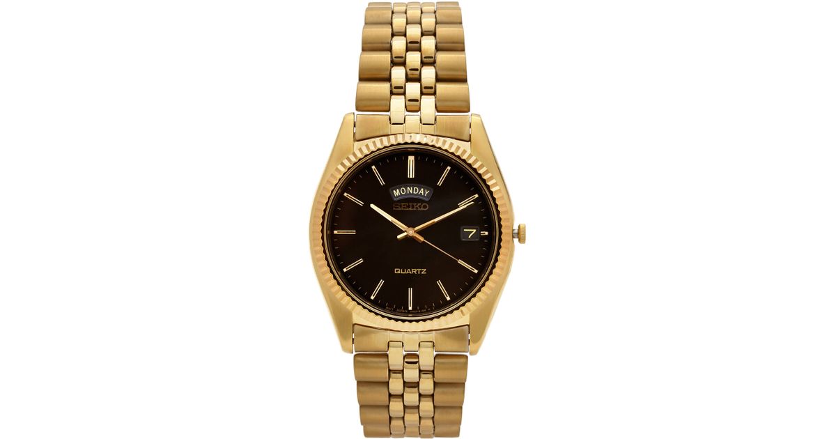 seiko gold watch with black face
