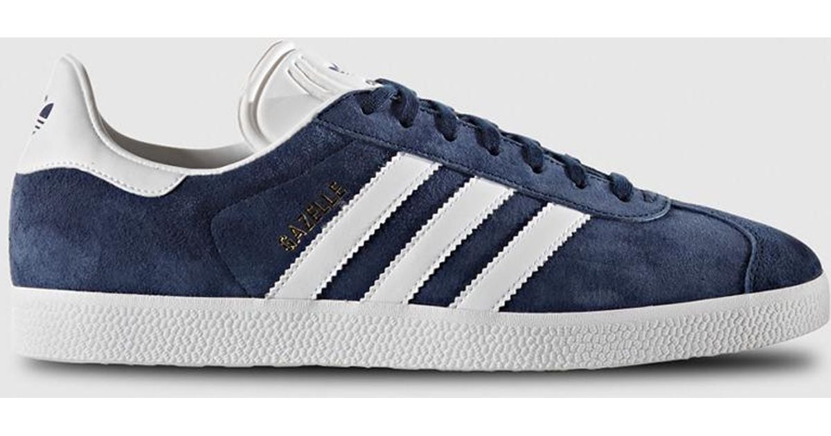 blue adidas with white stripes