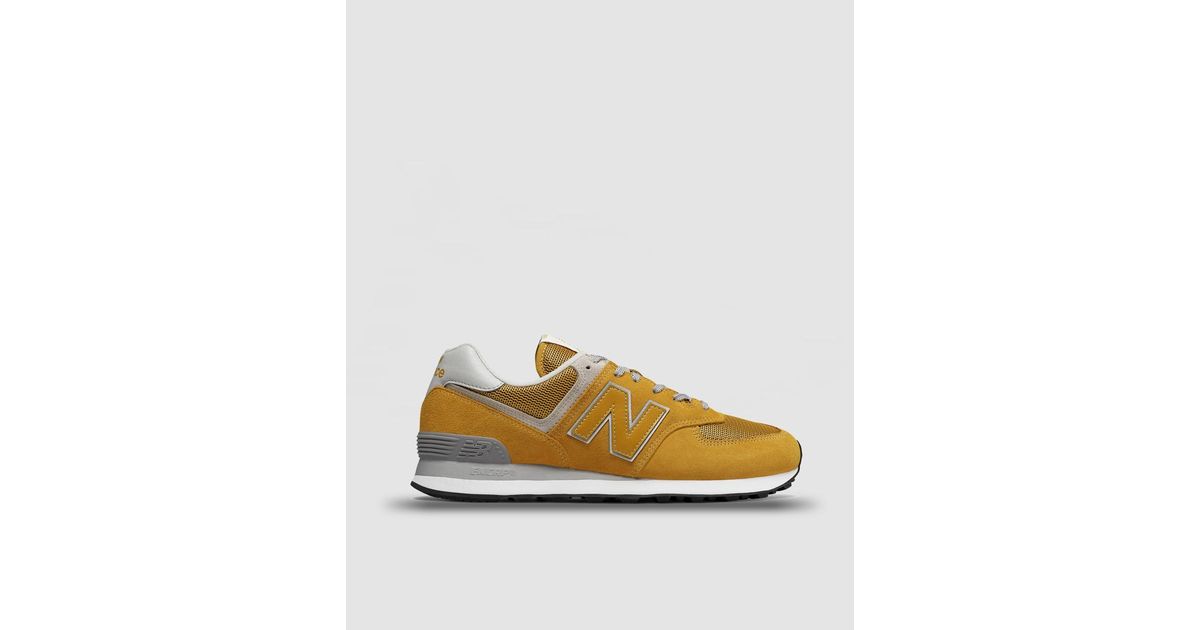 mustard new balance trainers