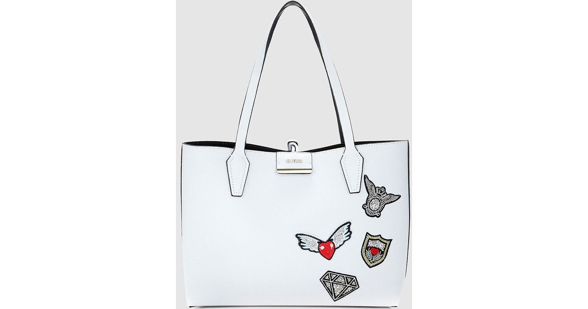 Guess Reversible Black And White Tote Bag With Patches - Lyst