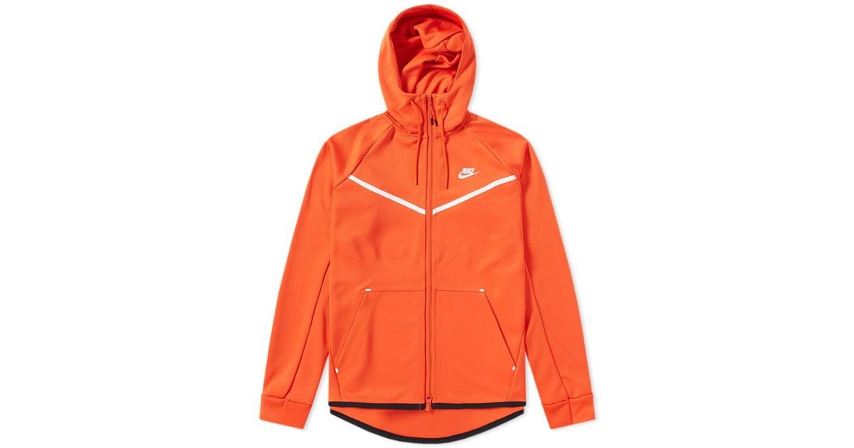 orange nike tech tracksuit