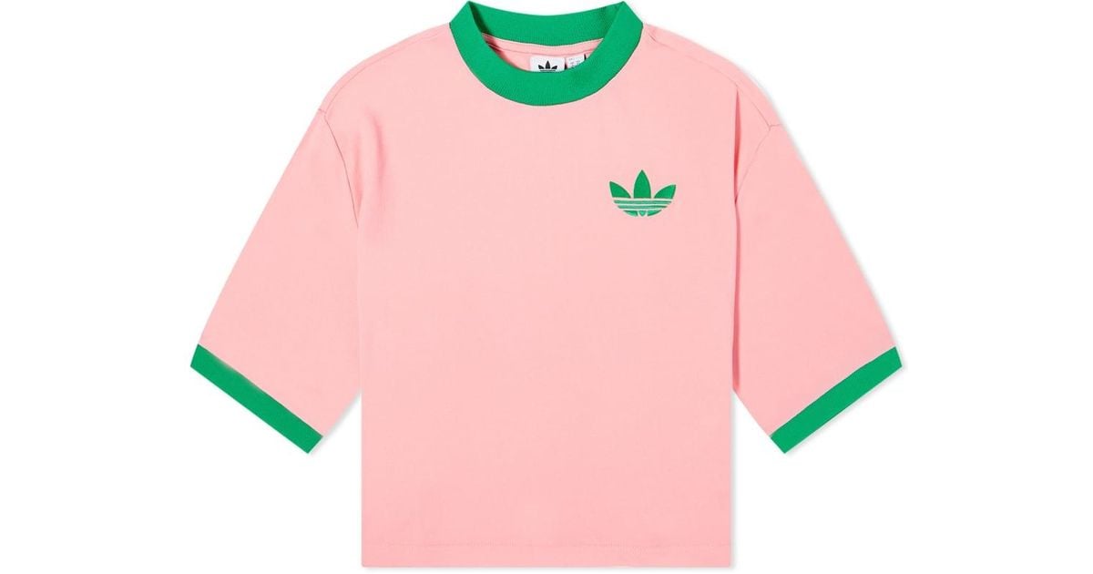 white adidas shirt with pink logo