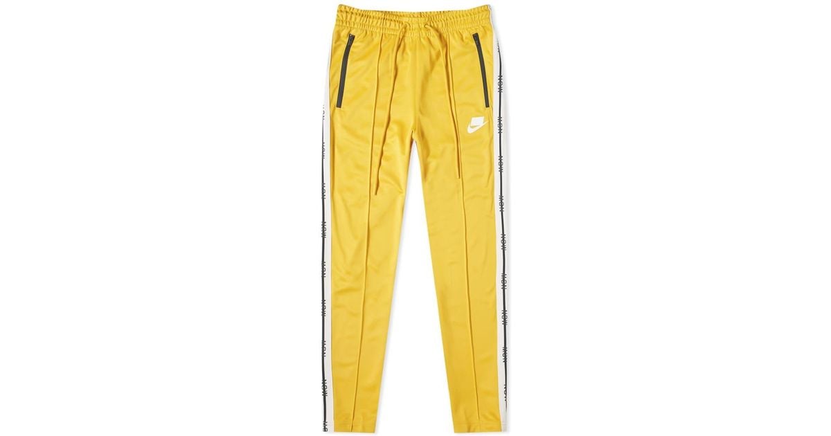 yellow nike track pants