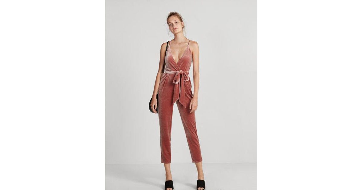 orange velvet jumpsuit