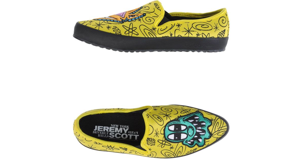 black and yellow adidas high tops