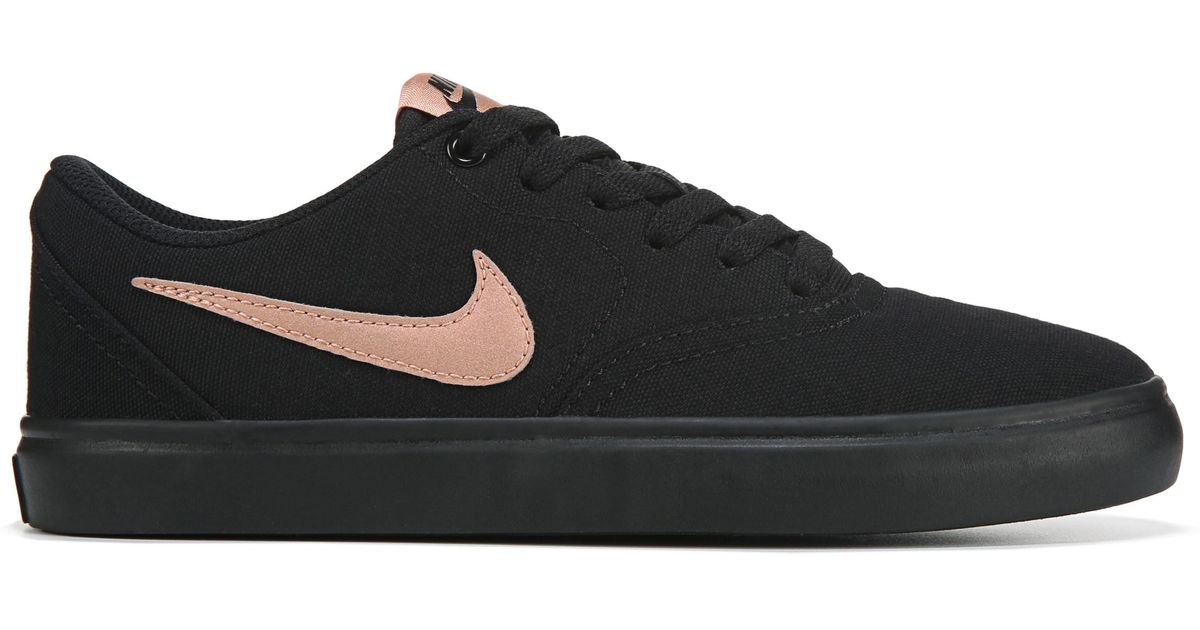 black nike with gold check