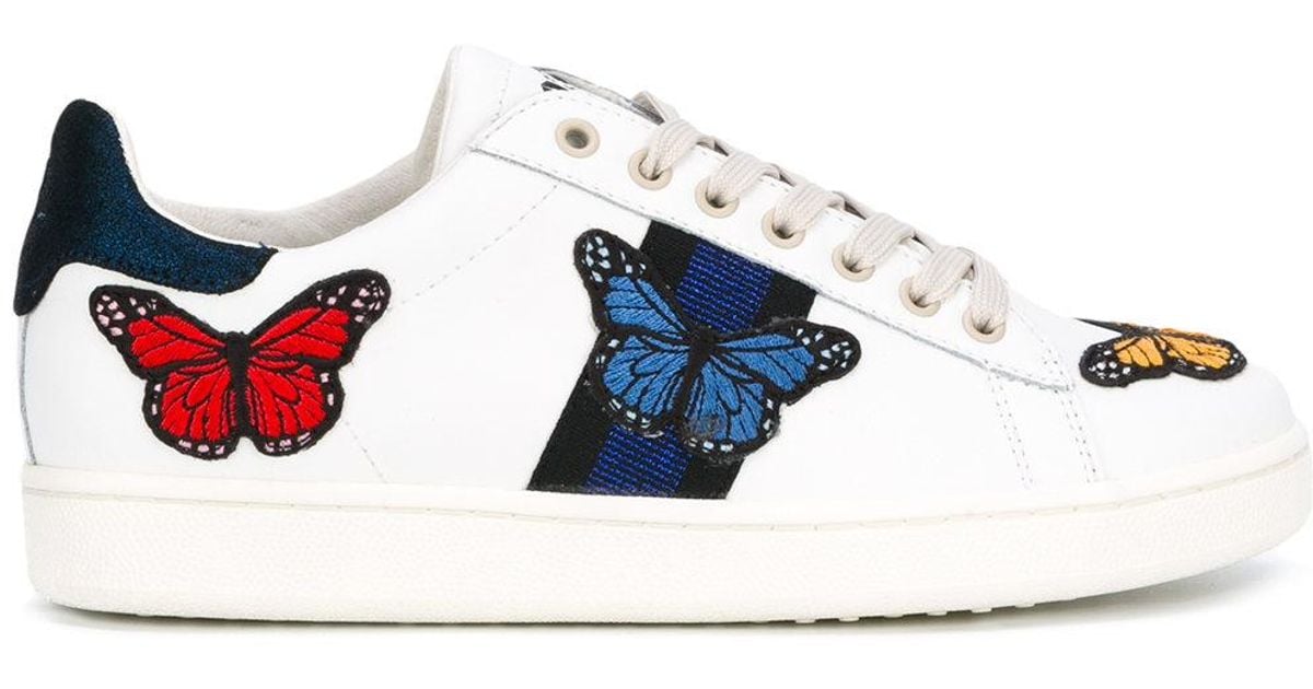 white butterfly sneakers