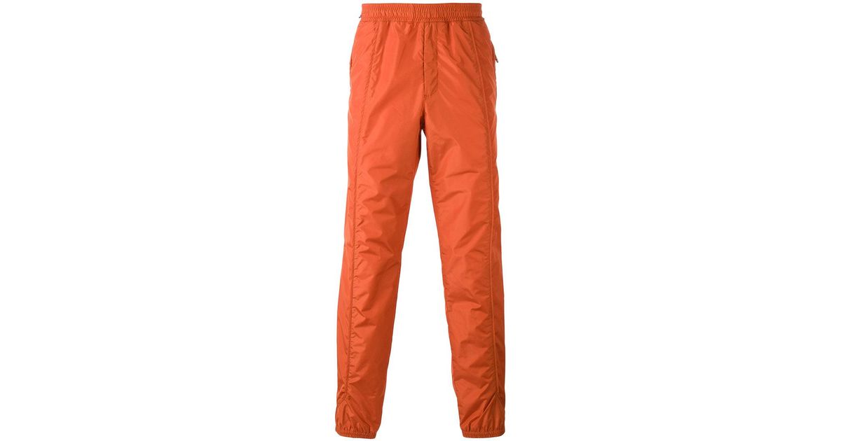 orange track pants