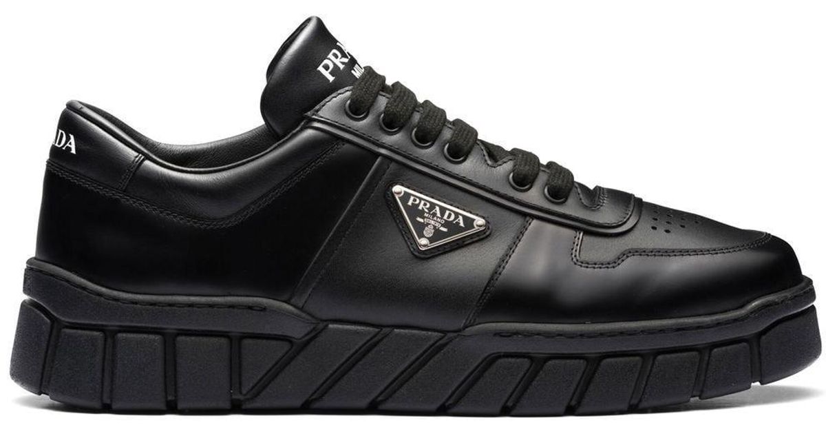 prada logo plaque lace up sneakers