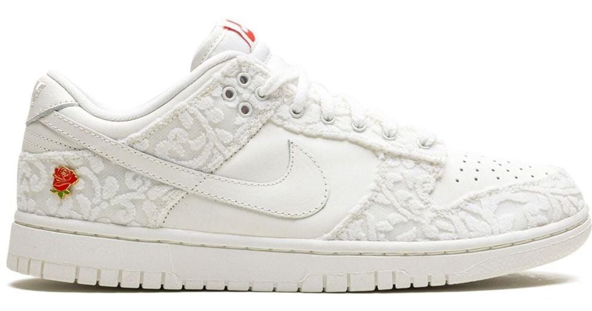 pink nike with flowers