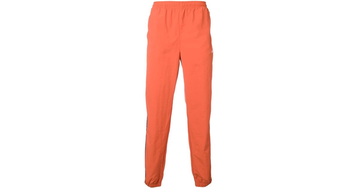 orange track pants adidas