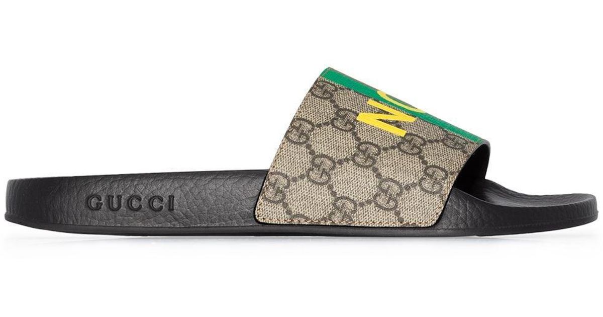 Ciabatte Fake/Not con stampa di Gucci in Marrone | Lyst