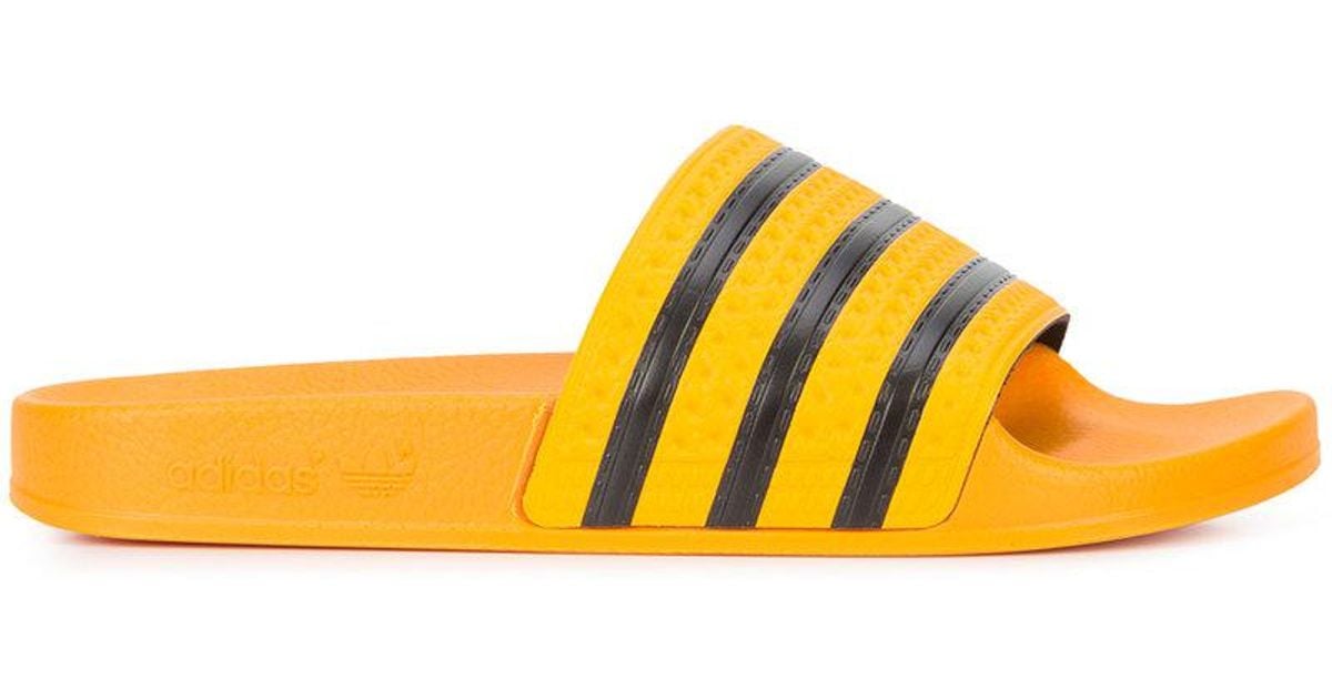 orange adidas slides
