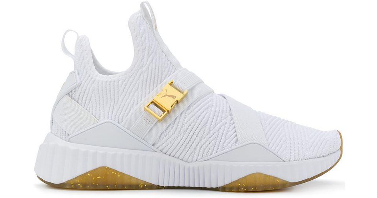 puma defy mid varsity white