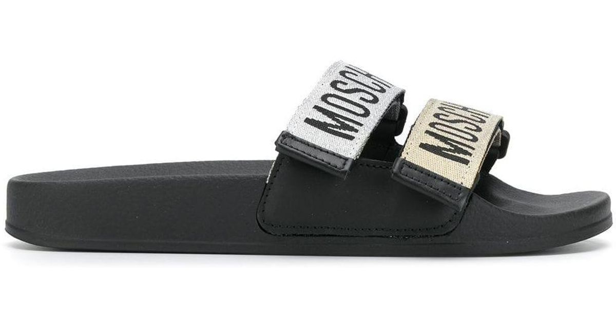 moschino monogram leather slides
