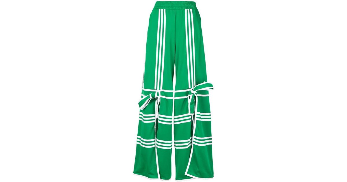 adidas Synthetic Flared Track Pants in Green | Lyst