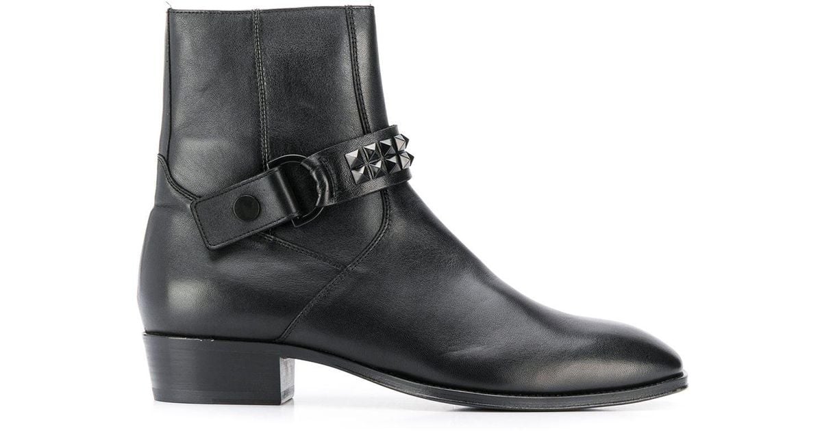 black studded strap ankle boots