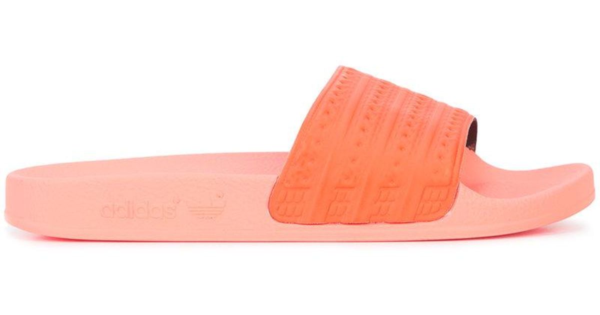 orange adilette slides