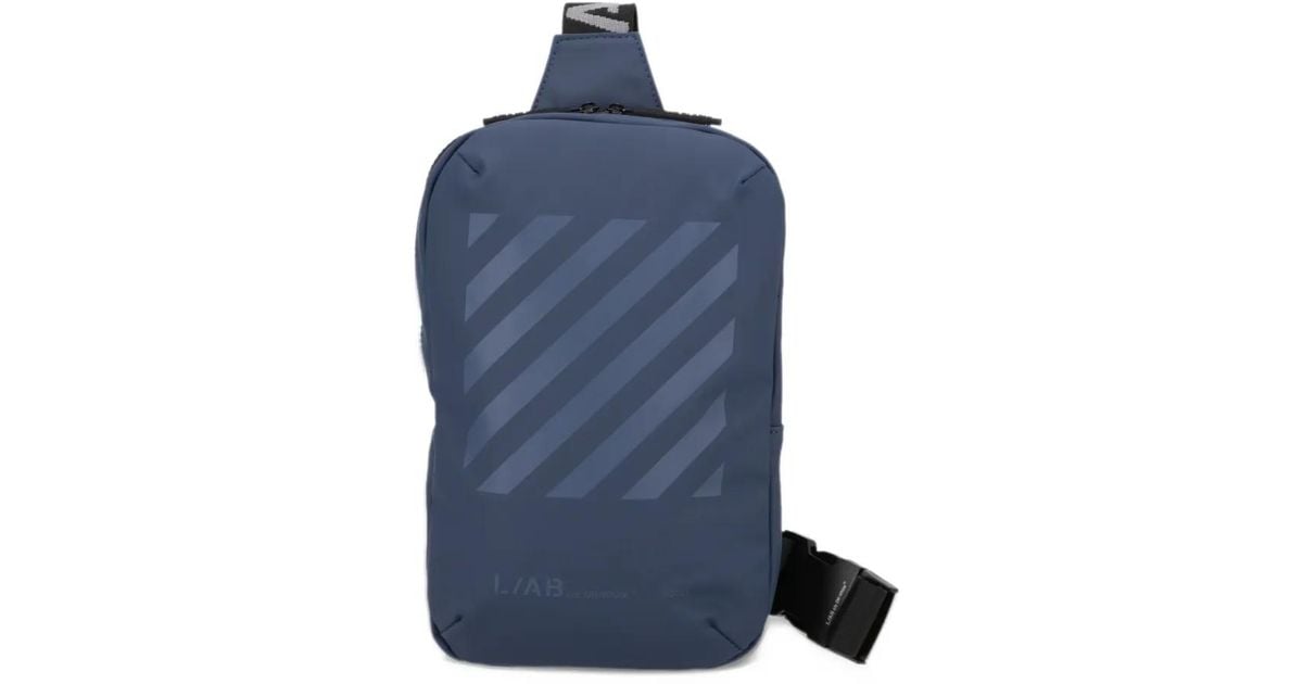 LuxeSupply Diagonals Industrial Sling Backpack in Blue | Lyst