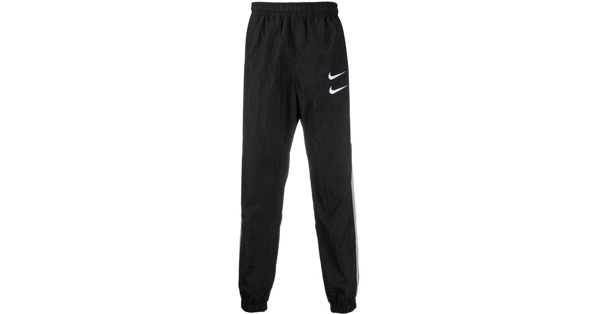 Que agradable Perplejo Si Pantalones de chándal con doble logo Swoosh Nike de hombre de color Negro |  Lyst
