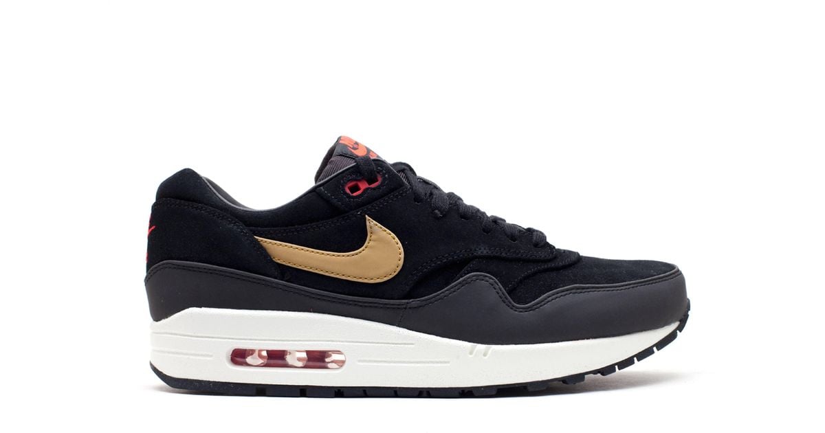 nike air max 1 black and gold