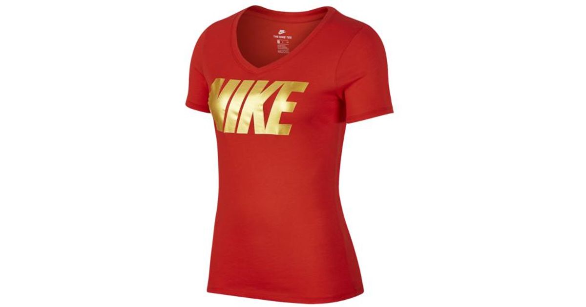 red and gold nike shirt