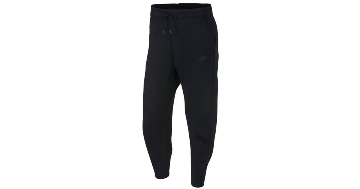 nike tech open hem pants