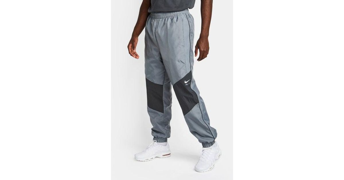 Nike track pants swoosh cheap
