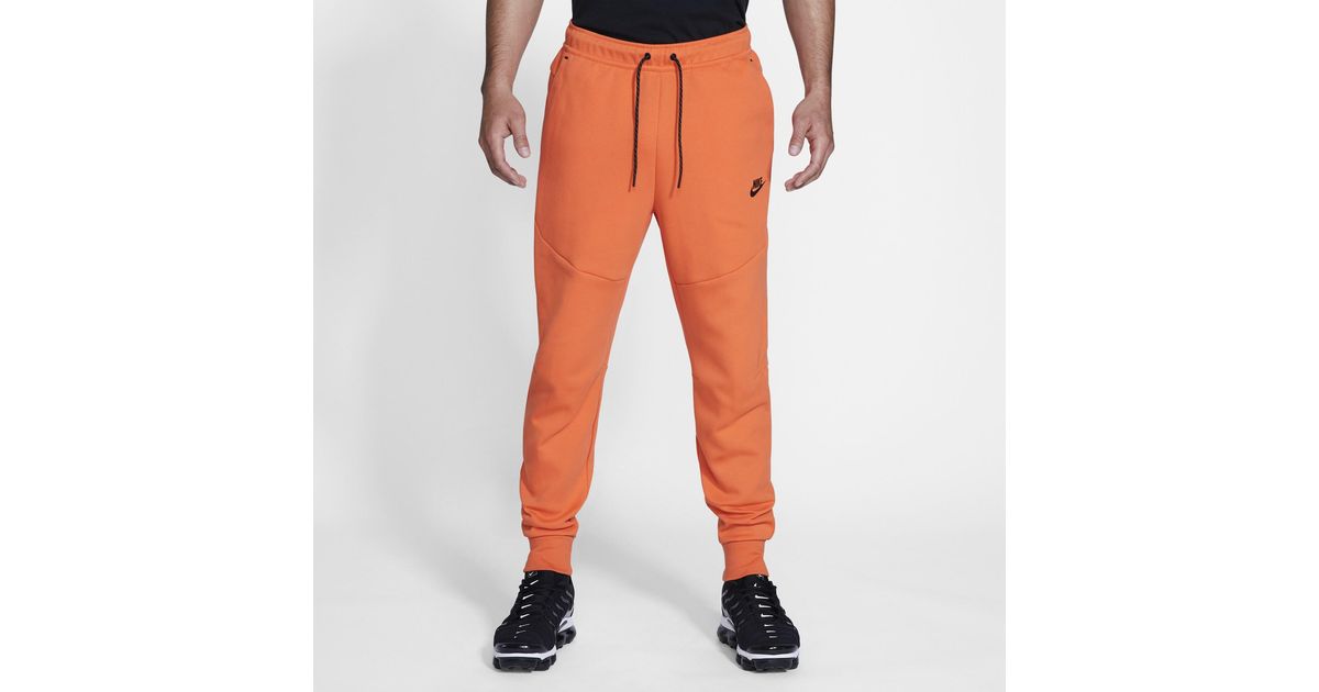 nike tech fleece orange joggers