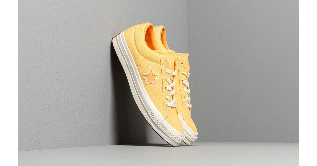 yellow and gray converse