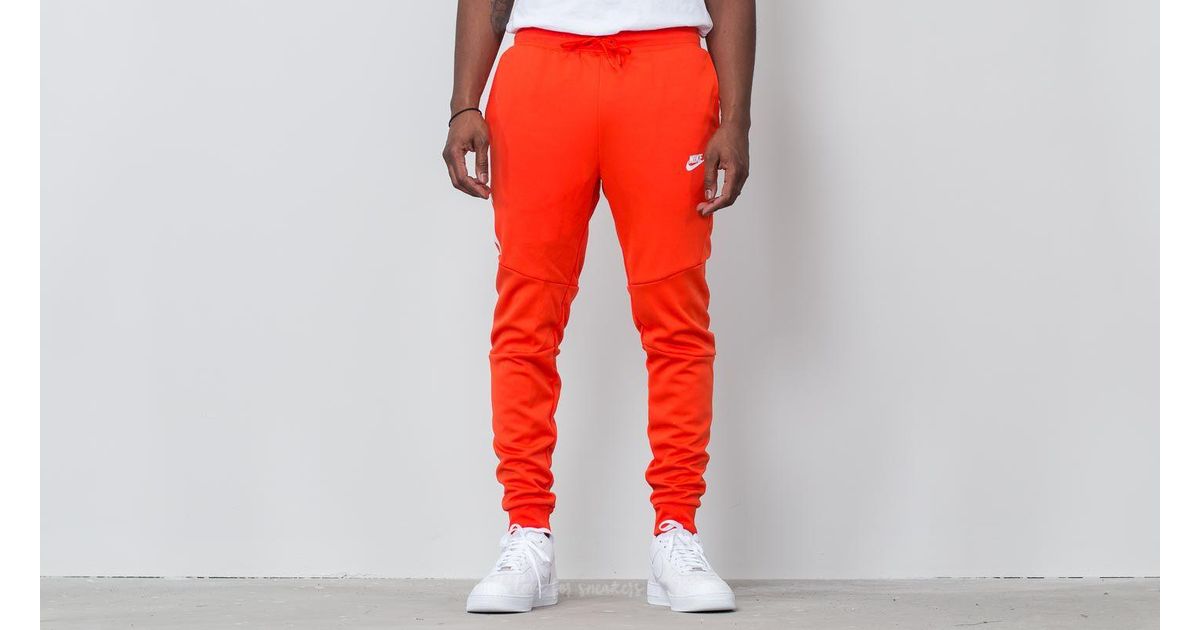 orange nike jogging pants